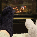 warm socks in front of a fireplace