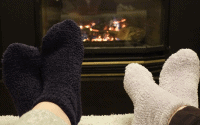 warm socks in front of a fireplace