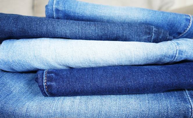 Stack of jeans in different washes